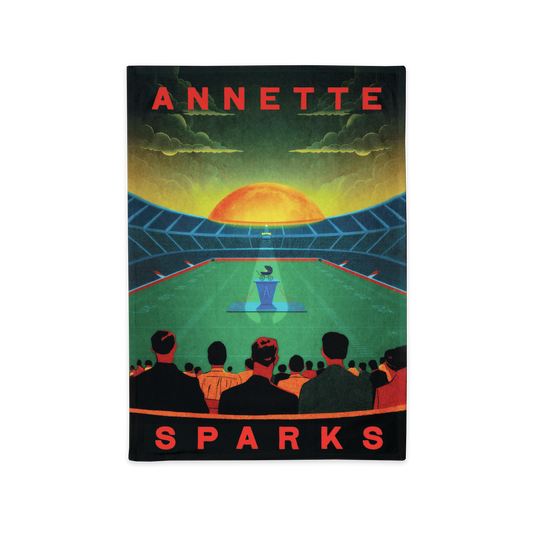 Movie or concert poster featuring a stylized stadium scene with ’ANNETTE SPARKS’ text.